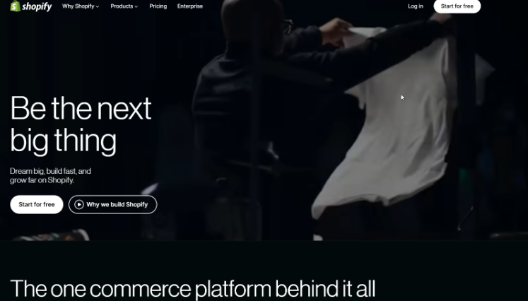 Homepage banner of an ecommerce platform featuring a creator preparing apparel with messaging about building and growing an online business.
